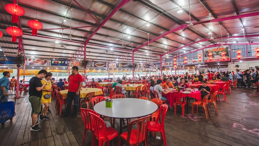 Seafood restaurant in Kuala Selangor with red lanterns and diners enjoying meals.
