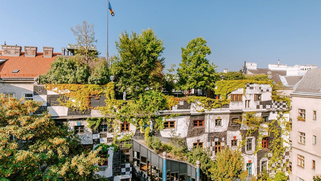 KUNST HAUS WIEN rooftop garden with lush greenery and colorful windows in Vienna.