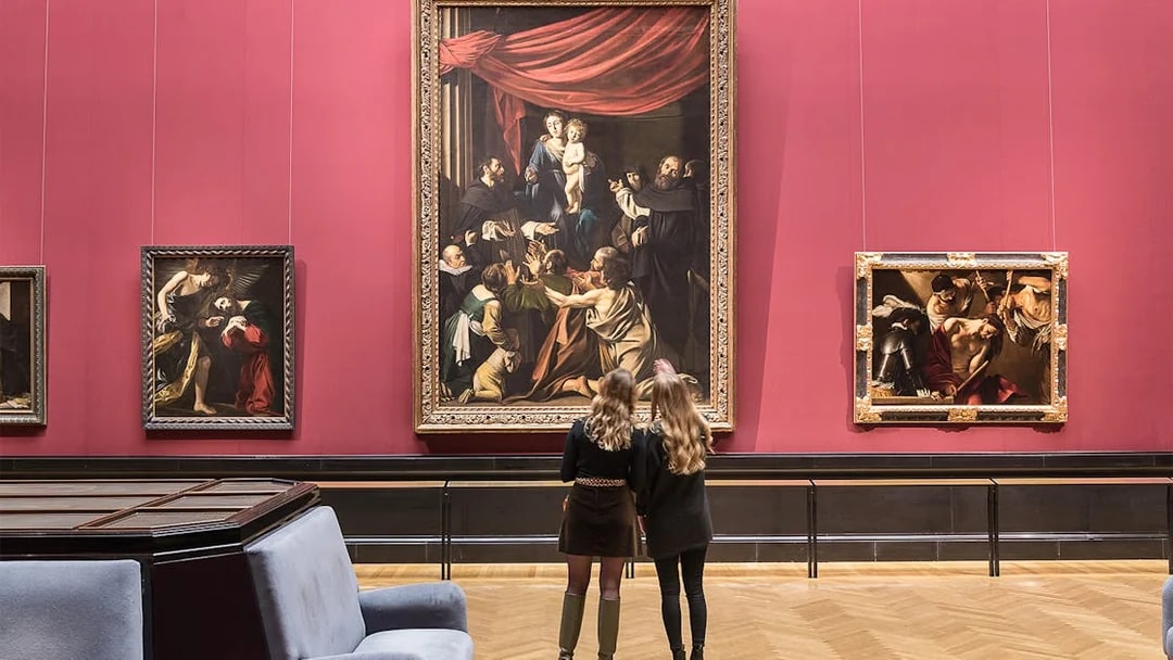 Visitors admiring paintings inside Kunsthistorisches Museum, Vienna.