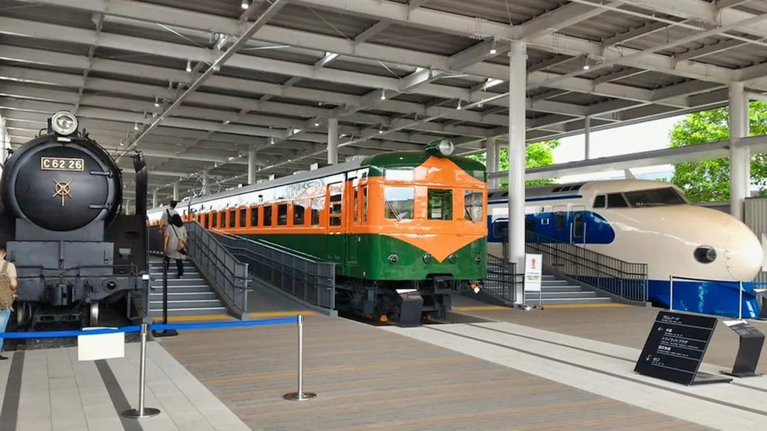 Steam, electric, and bullet trains displayed at Kyoto Railway Museum.