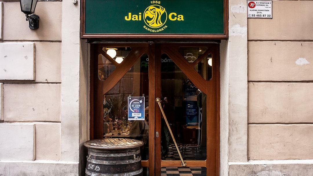 Entrance of Jai Ca restaurant in La Barceloneta, Barcelona, part of a guided food tour.