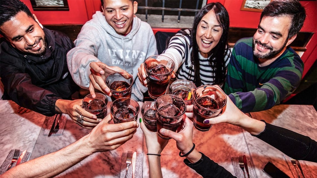 Group toasting drinks during La Barceloneta food tour.