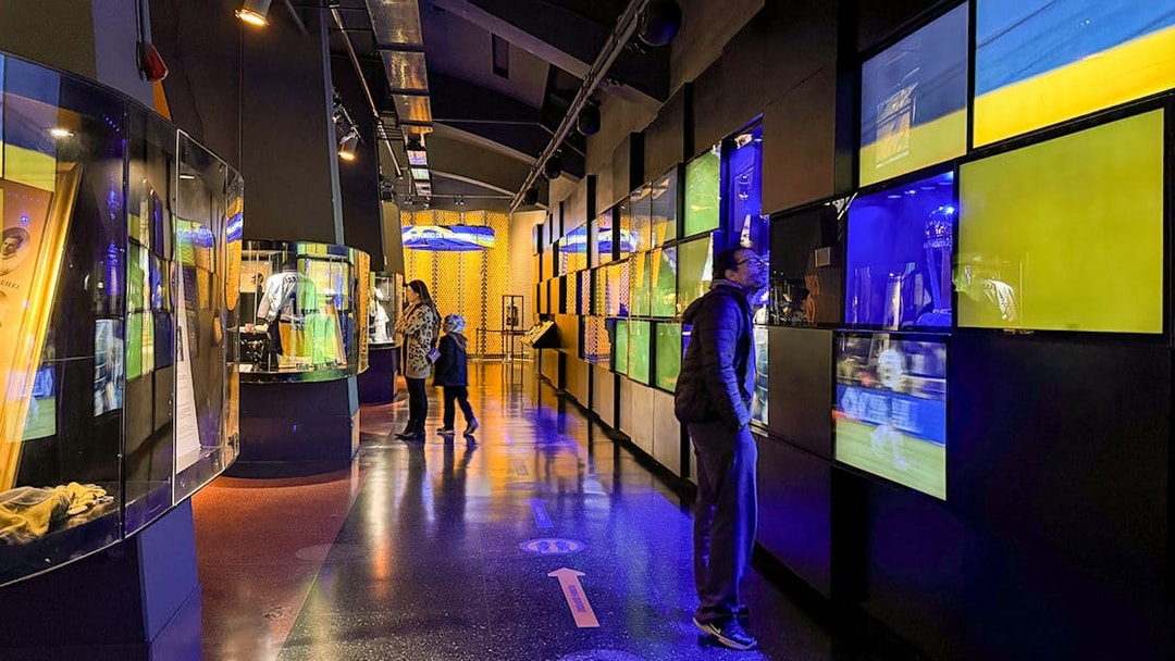 Visitors exploring exhibits inside La Bombonera stadium museum in Buenos Aires.