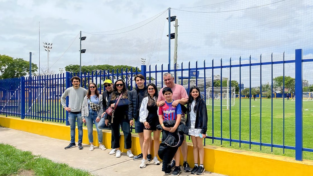 Tourists posing for photos near La Bombonera stadium in Buenos Aires.