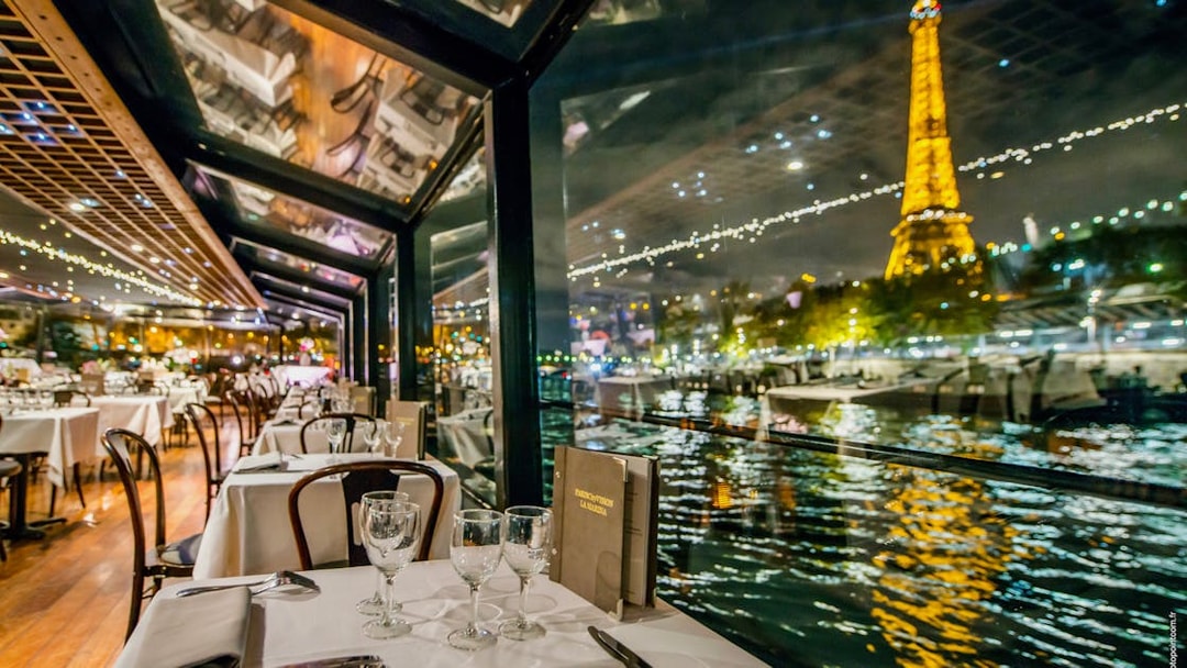 La Marina dinner cruise on Seine River, Paris, with champagne and illuminated Eiffel Tower.