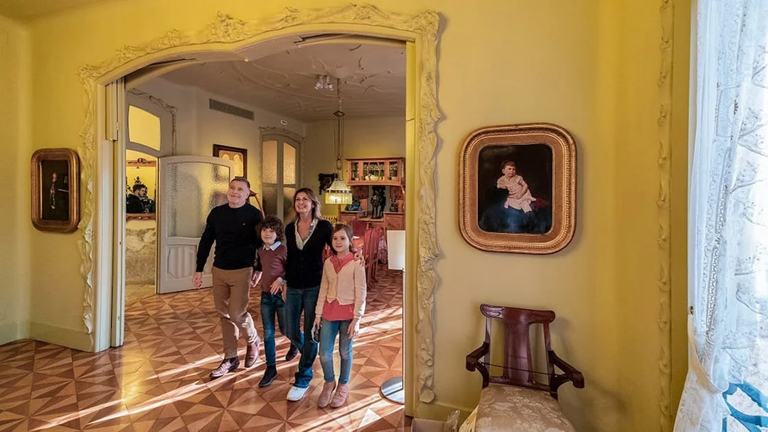 Visitors exploring an ornate room at La Pedrera-Casa Milà, Barcelona.