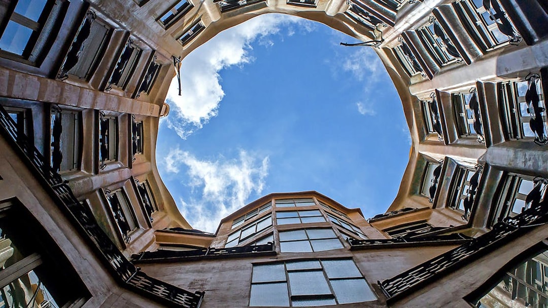 Casa Mila courtyard view with open sky in Barcelona.