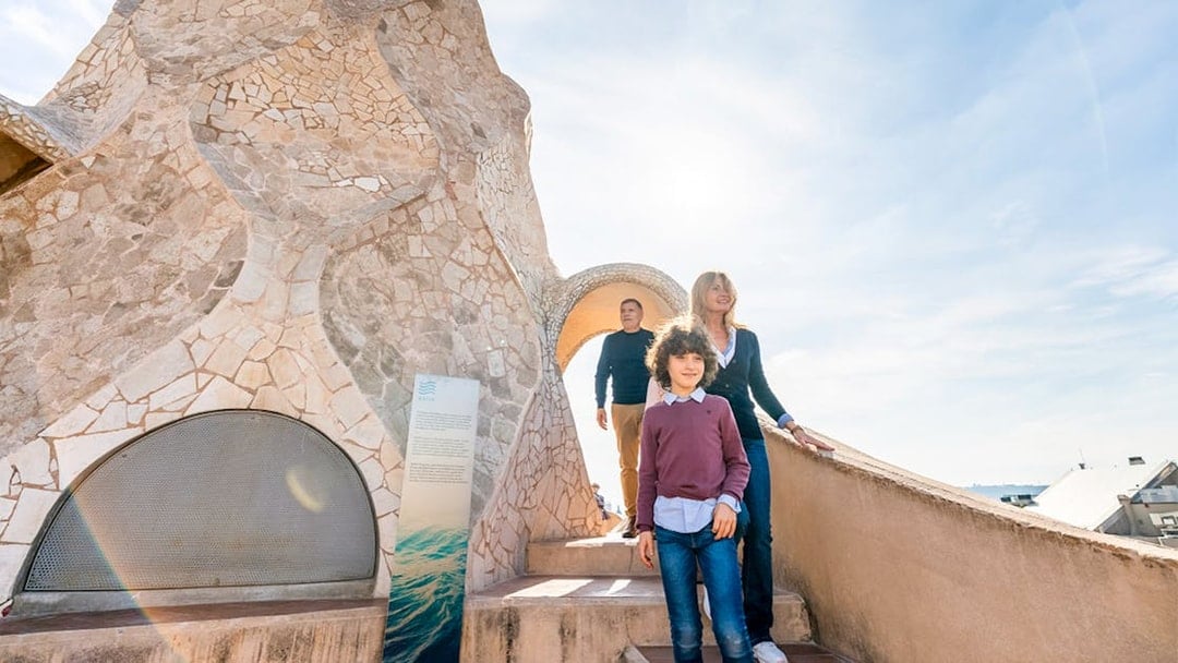 Family exploring Casa Mila Warrior Rooftop in Barcelona.