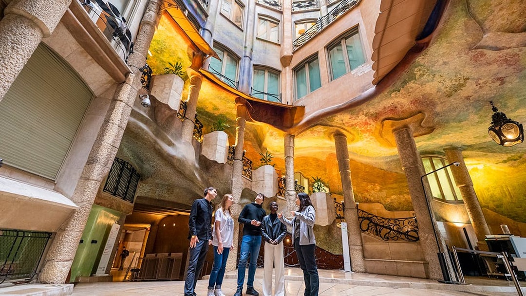 Visitors exploring Casa Milà's interior during La Pedrera Sunrise Tour in Barcelona.
