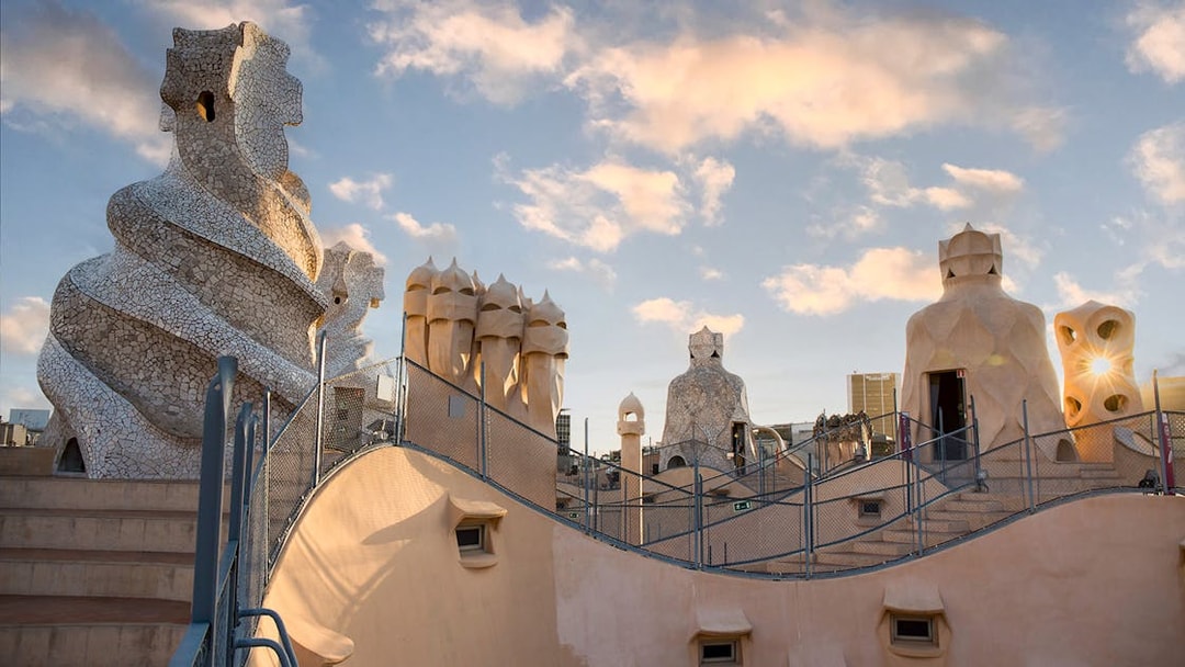 Casa Milà rooftop chimneys at sunrise during La Pedrera tour in Barcelona.