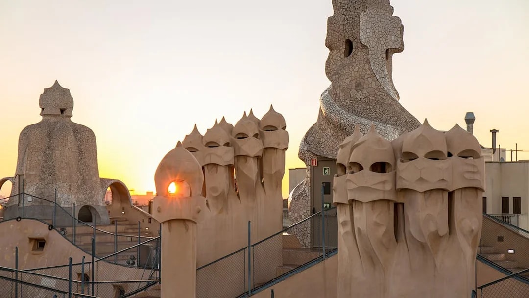 Rooftop chimneys of Casa Milà at sunrise during La Pedrera Sunrise Tour in Barcelona.