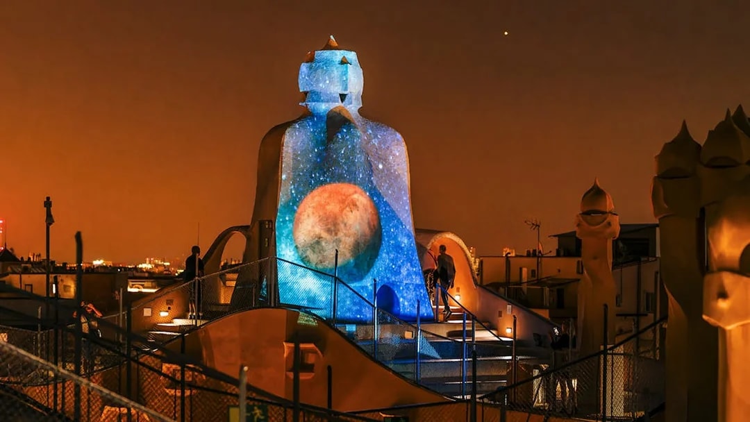Casa Mila rooftop with night projection during La Pedrera Night Experience in Barcelona.