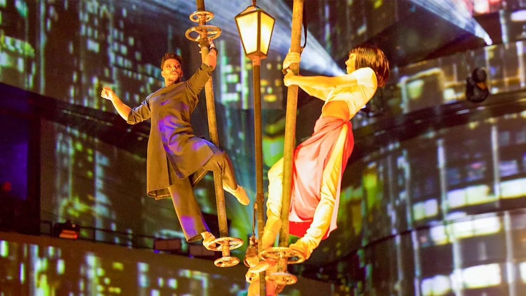 Performers on poles during La Perle By Dragone show in Dubai.