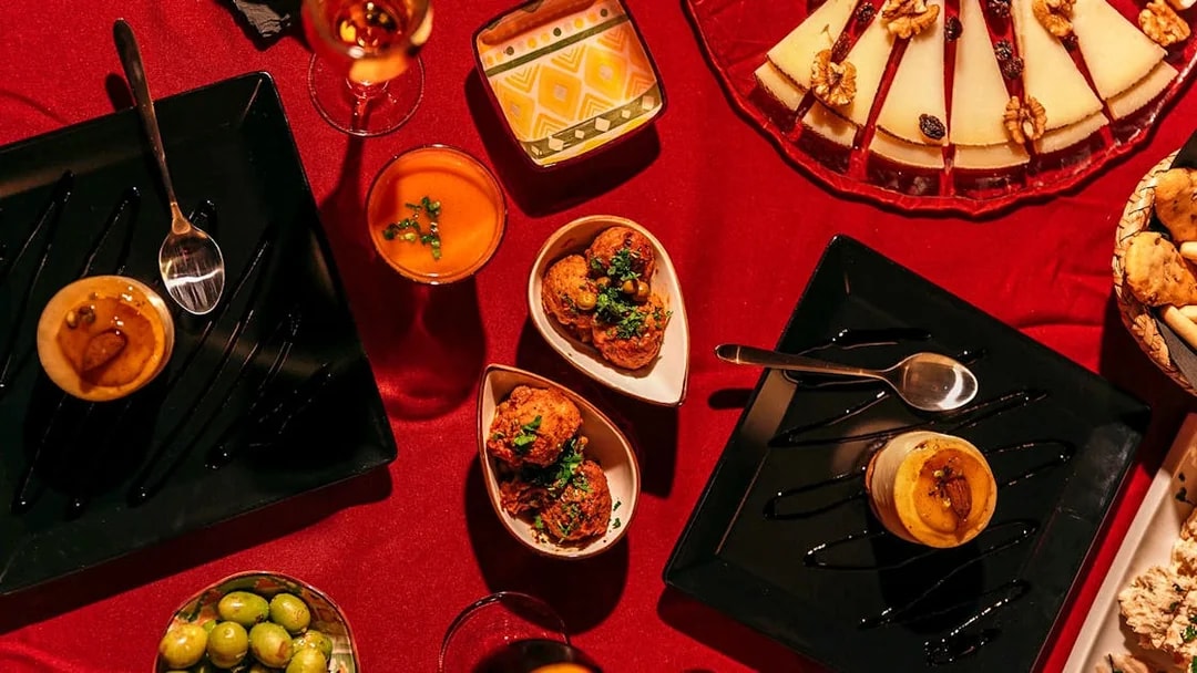 Traditional Spanish tapas on a red tablecloth at Laietana Flamenco Show.