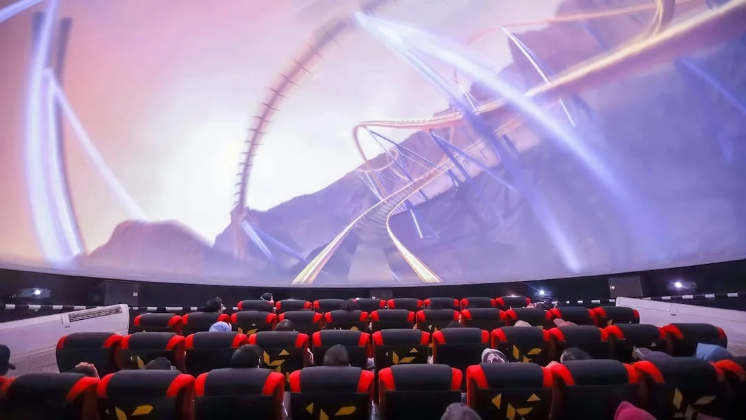 Visitors watching a roller coaster simulation at SkyDome, Langkawi.
