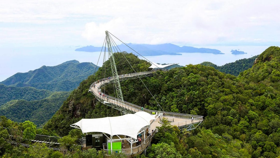 Sky Bridge at Langkawi spanning lush green mountains with distant sea view.