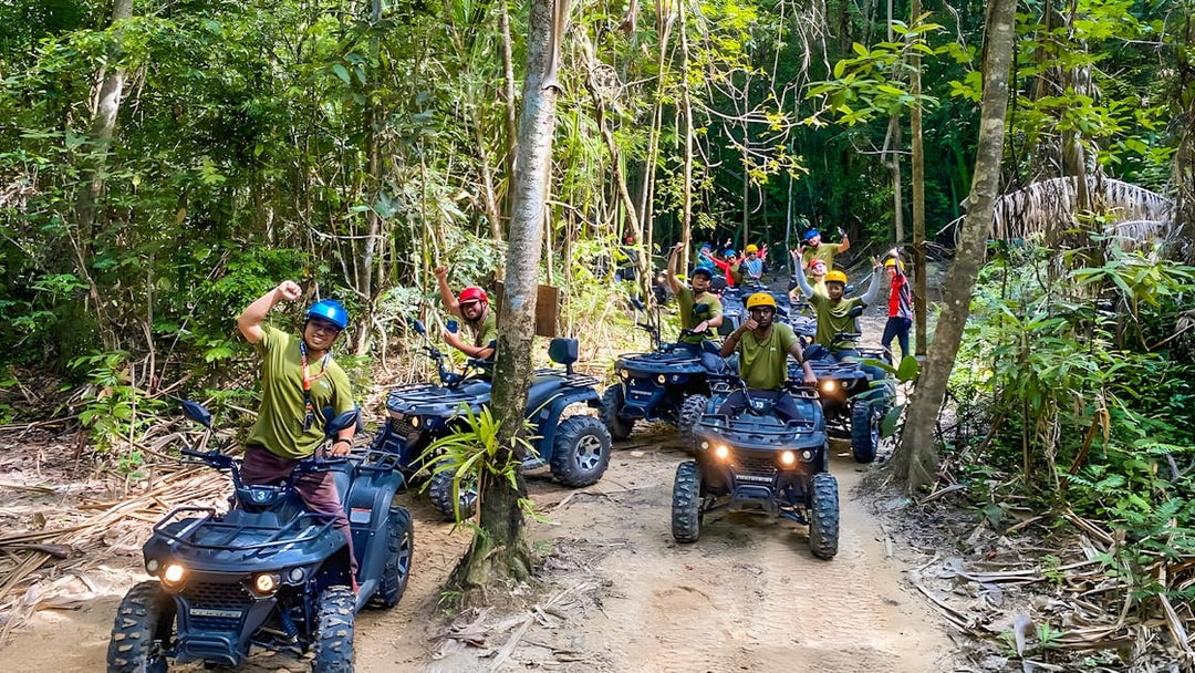 ATV riders on a forest trail during Langkawi Sky ATV Ride at Mountain Manchinchang.
