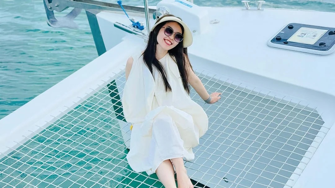 Woman relaxing on a jacuzzi net during Langkawi Sunset Cruise.