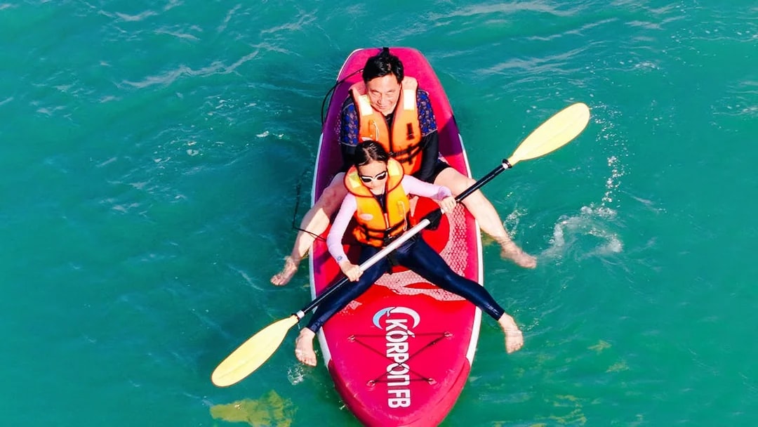 Kayakers paddling during Langkawi Sunset Cruise.
