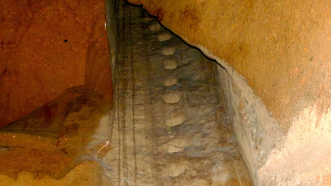 Ancient stone staircase inside LAPIS Museum, Naples, Italy.