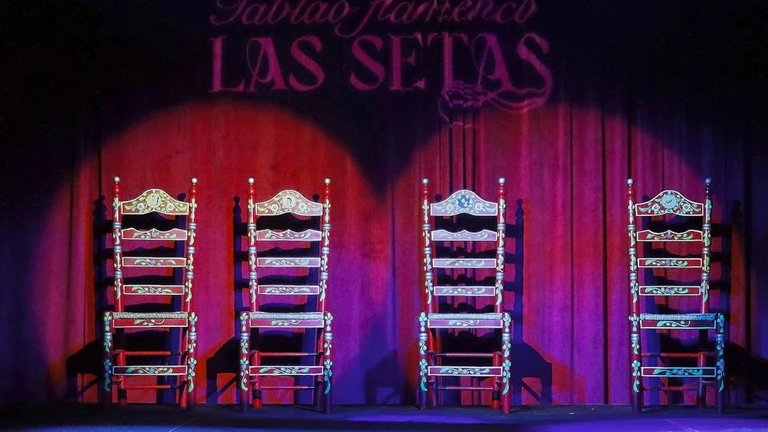 Four ornate chairs on stage at Tablao Flamenco Las Setas, Seville.
