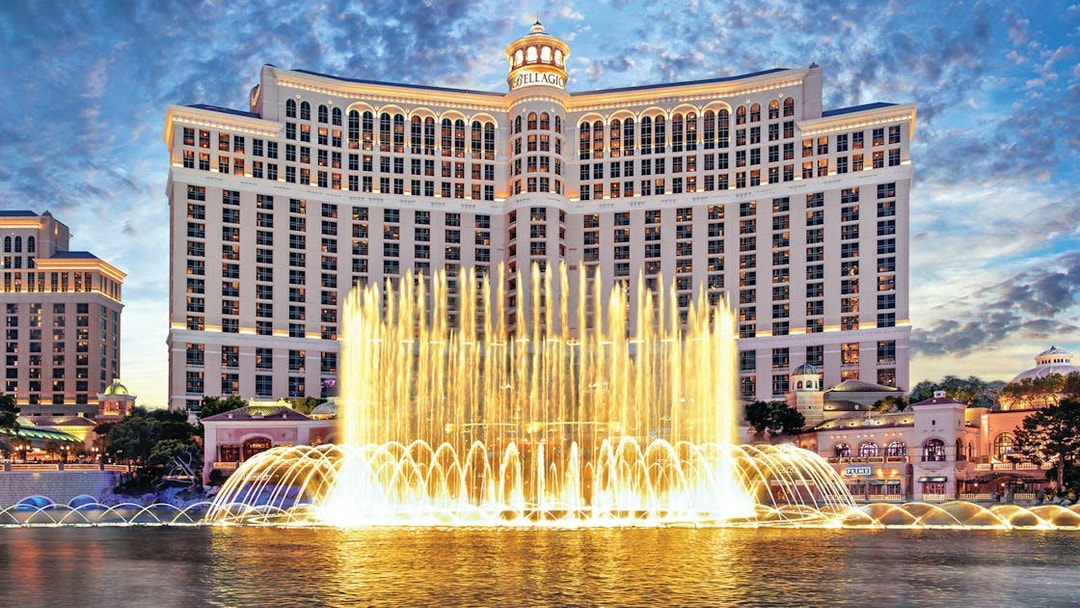 Bellagio Hotel and Fountains in Las Vegas at dusk.
