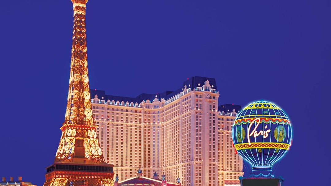Eiffel Tower replica and Paris Las Vegas hotel at night, Las Vegas.
