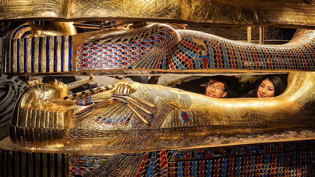 Visitors inside a replica of an Egyptian sarcophagus at a Las Vegas attraction.