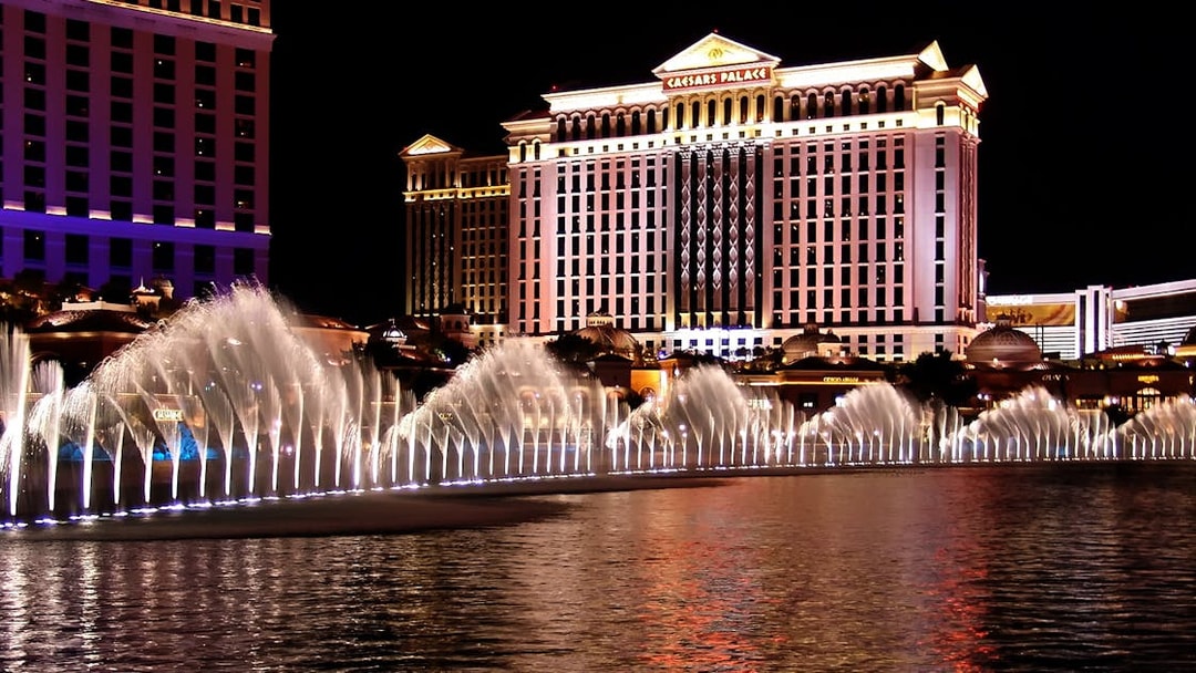 Fountains at night in front of Caesars Palace, Las Vegas Self Guided Audio Tour.