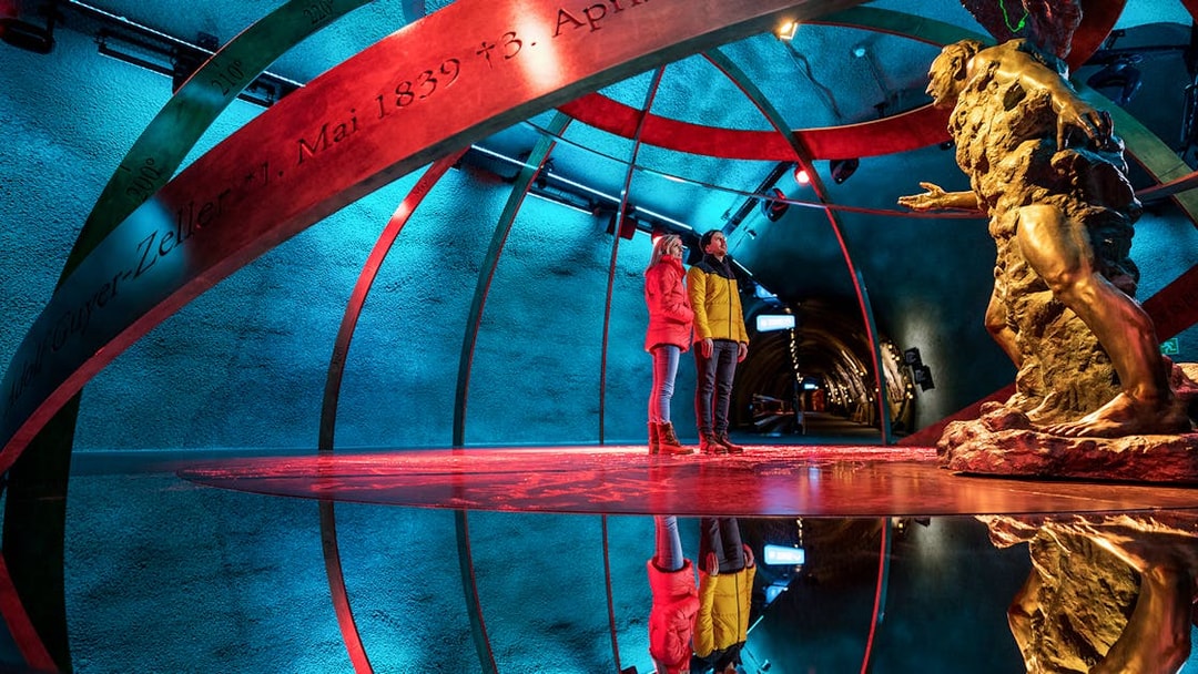 Visitors exploring the Ice Palace at Jungfraujoch, Switzerland.