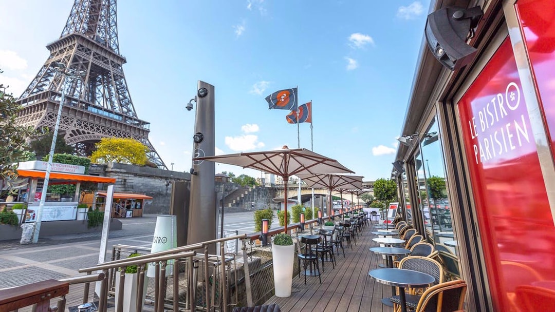 Le Bistro Parisien terrace with Eiffel Tower view, Paris, France.
