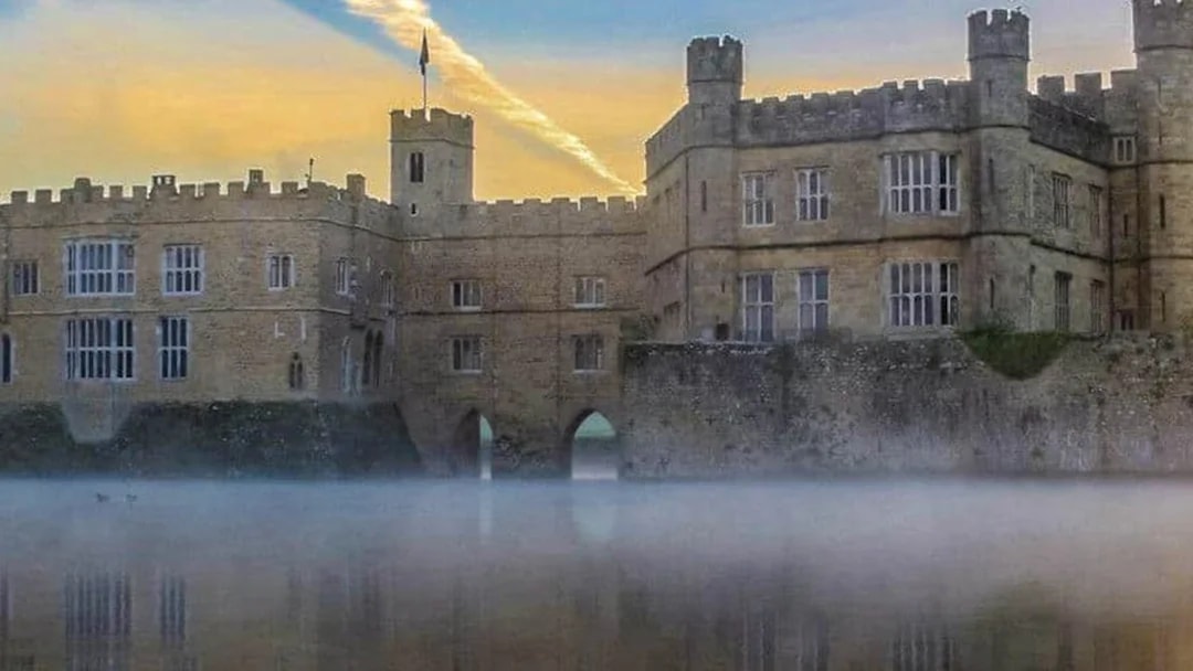 Leeds Castle with mist over the moat at sunrise, part of the Leeds Castle, Canterbury Cathedral & White Cliffs of Dover Tour.