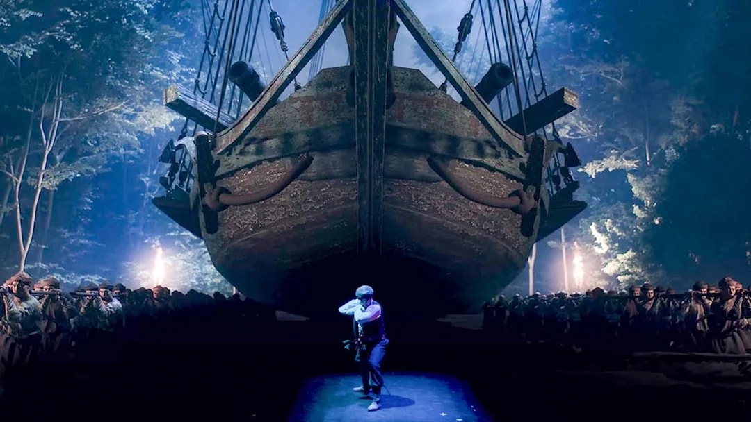 Performers in action at Legends of Istanbul with a large ship backdrop.