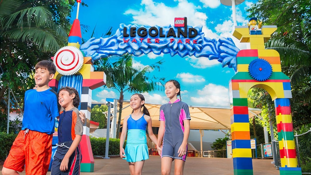 Children entering LEGO-themed entrance at LEGOLAND Malaysia Water Park.