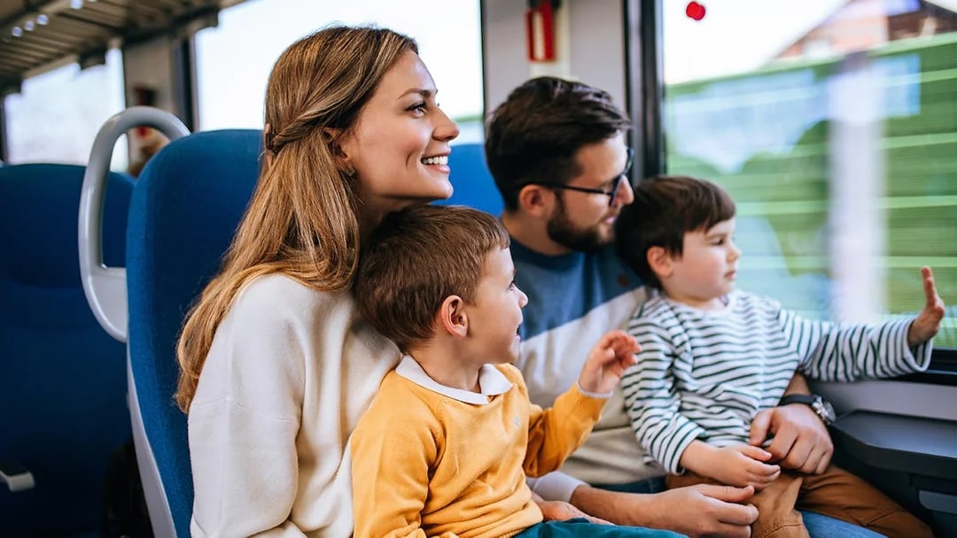 Family enjoying a scenic coach transfer journey.