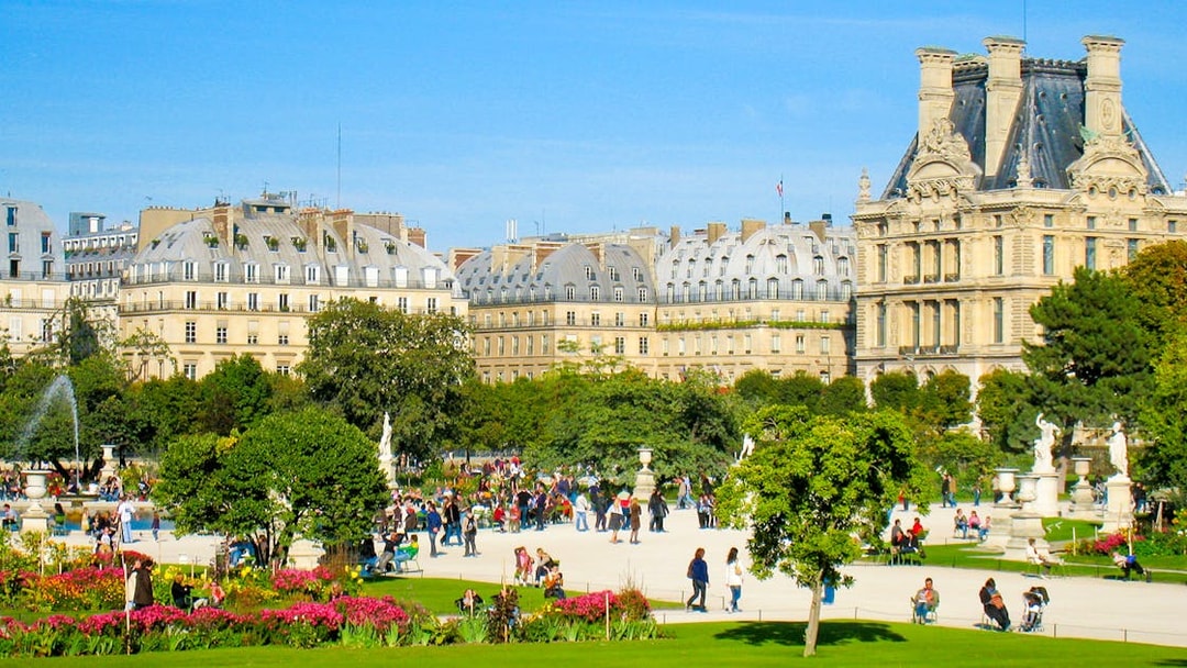 Tuileries Gardens with visitors near Grand Carre, Paris.