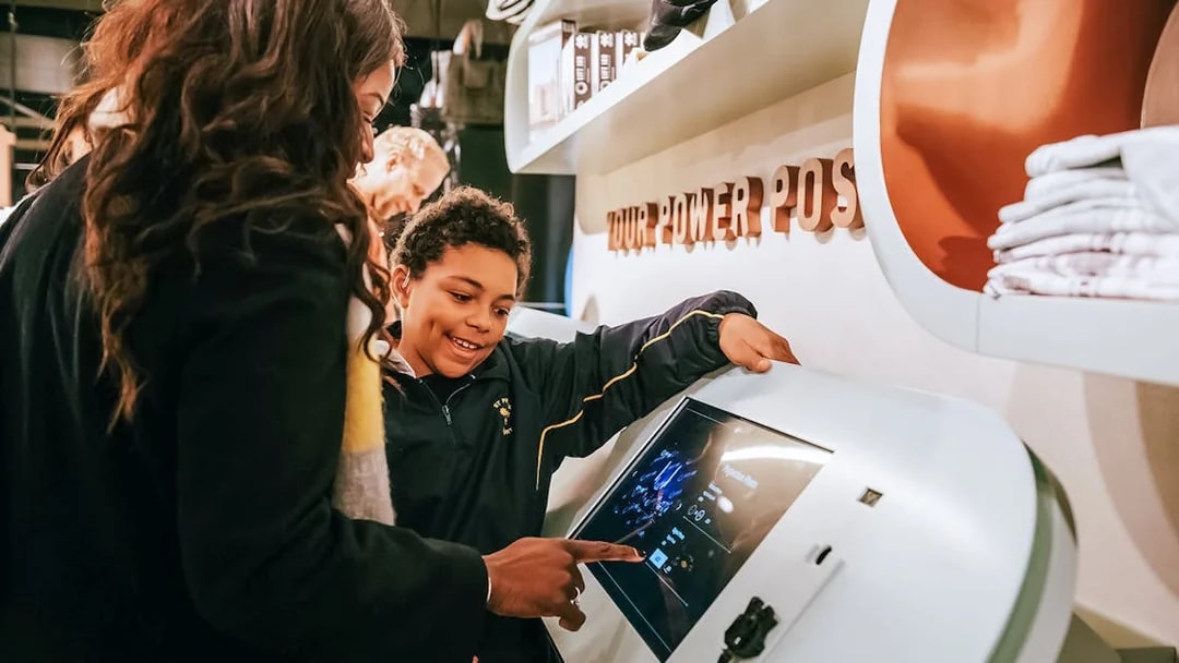 Visitors interacting with a digital display at Battersea Power Station's Lift 109 experience.
