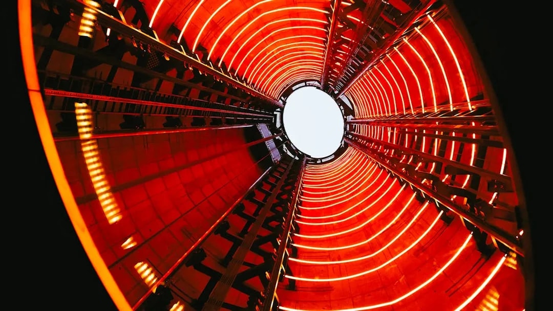 View from inside Lift 109 at Battersea Power Station with red neon lights.