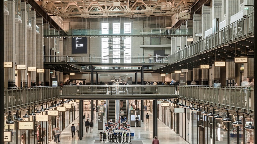 Interior view of New Battersea Power Station with shops and walkways.