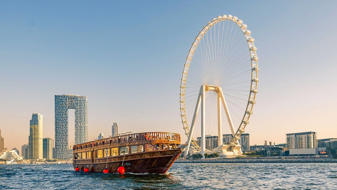 Dhow cruise near Dubai Marina with Ain Dubai Ferris wheel in the background.