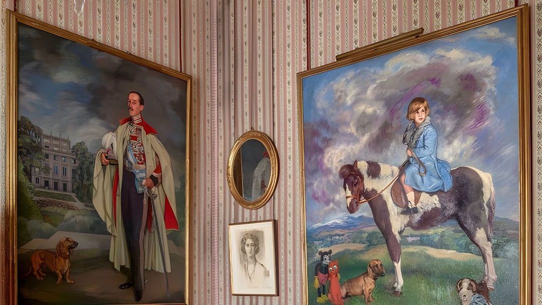 Paintings in Liria Palace featuring a man with a dog and a child on a horse.
