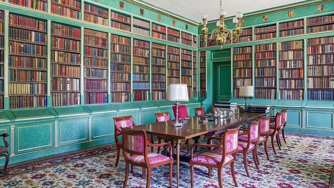Liria Palace library with ornate bookshelves and historical artifacts in Madrid.