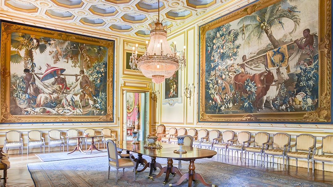Large paintings in an ornate room at Liria Palace, Madrid.