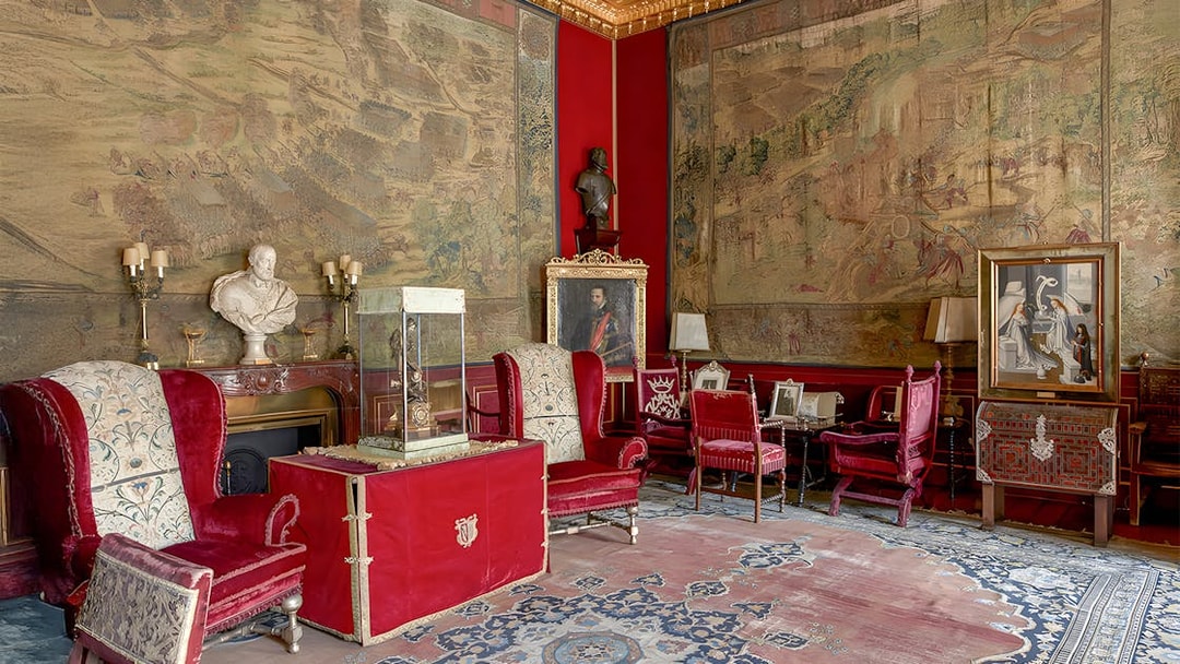 Royal artworks and furnishings in Liria Palace's ornate room.