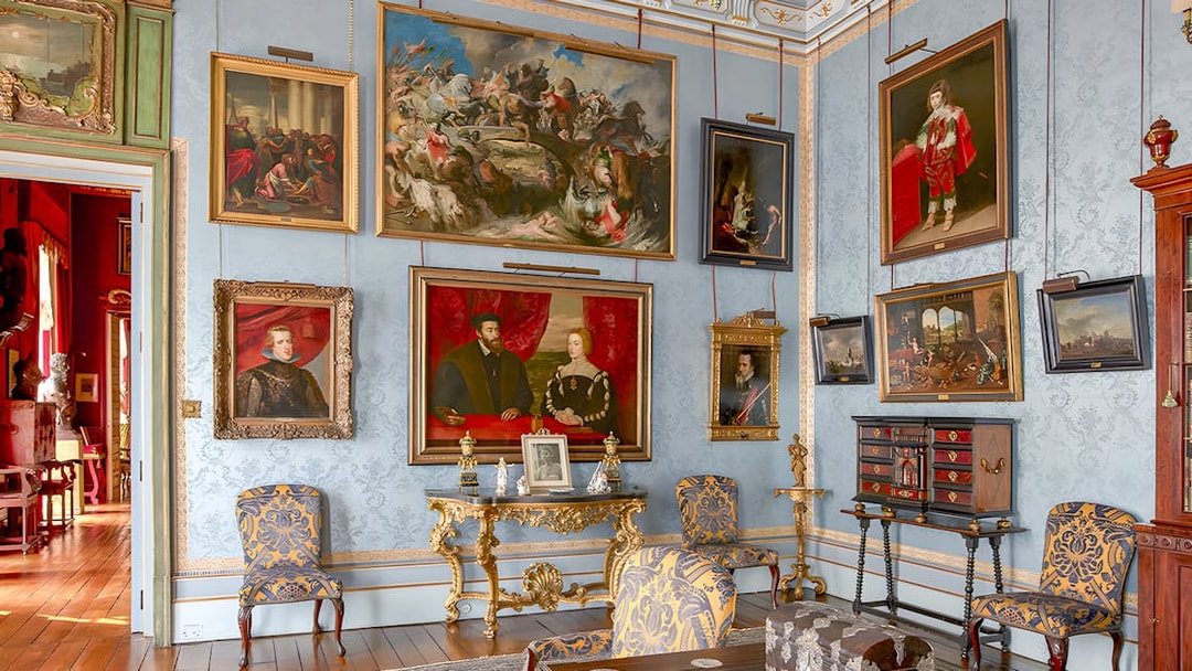 Art-filled room in Liria Palace with ornate furniture and historical paintings.