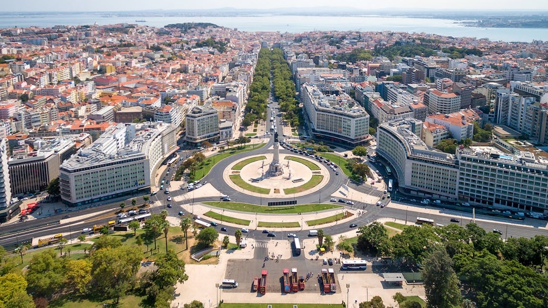 Aerial view of Lisbon's Marquês de Pombal Square with surrounding cityscape, part of Lisbon & Belém tour.