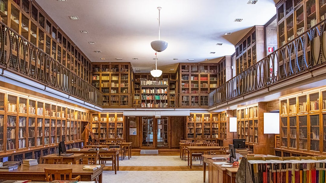 Library room with wooden bookshelves at the National Museum of Ancient Art.