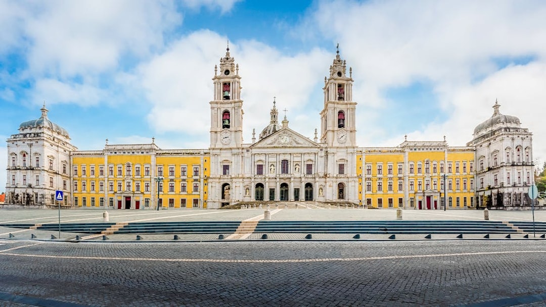 Palace of Mafra facade with twin bell towers, Mafra, Portugal.