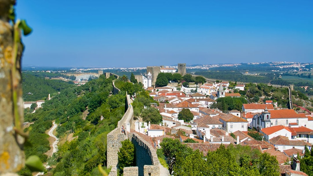 Óbidos town view with medieval walls and castle, part of Fatima, Óbidos, Nazaré & Batalha tour from Lisbon.