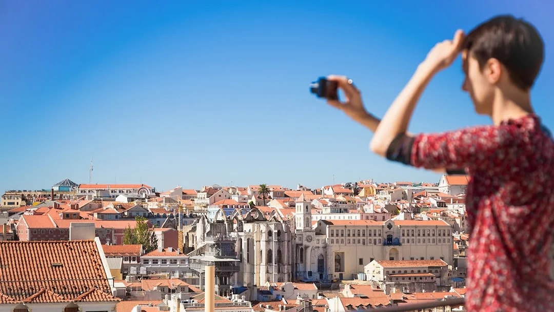 Lisbon cityscape view with Carmo Convent during guided walking tour.